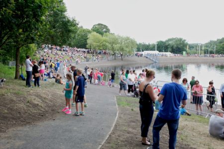 Hundreds of barriers being used to provide crowd management by a lakeside during the Commonwealth Games