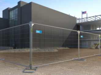 Installation of temporary fence panels at a construction site