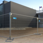 Square-top temporary fence panels at a construction site